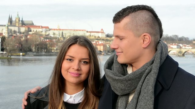 young happy couple smile on the bridge - city - closeup