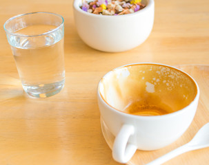 Empty white cup of hot coffee latte on wooden table