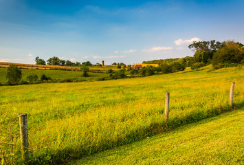 Fototapeta na wymiar Fence and farm field in rural Howard County, Maryland.