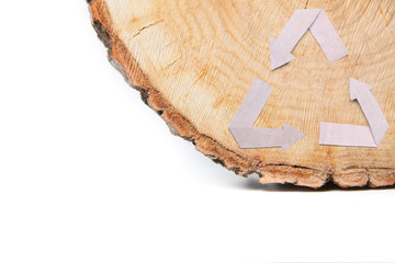 Close-up wooden cut and recycle symbol