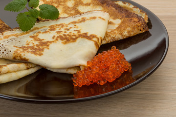 Pancakes with red caviar