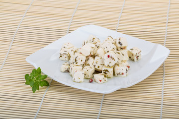 Cheese with spices and oil
