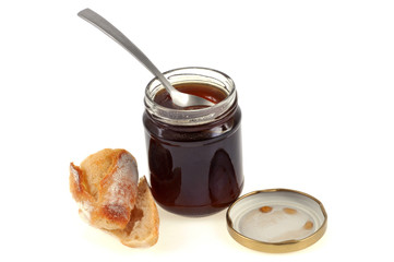 Un pot de miel et un morceau de pain