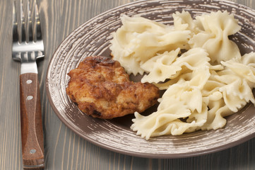 Chicken meat with pasta farfalle