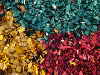 pattern of yellow, red and greeny blue  wood chips
