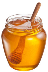 Glass can full of honey and wooden stick in it. Clipping paths.