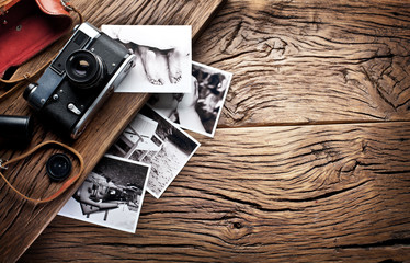 Old rangefinder camera and black-and-white photos.