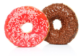 Donuts with sprinkles on white background .