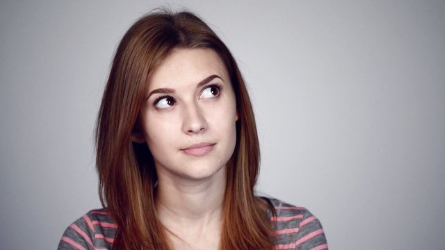 Thinking woman looking in different directions