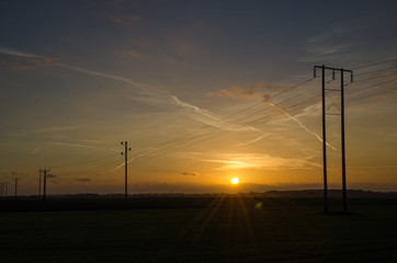 Fototapeta na wymiar Power lines at sunset