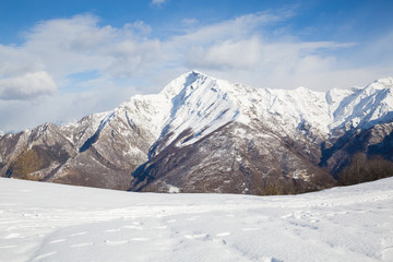 snowy mountains with clouds