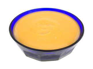 Butterscotch pudding in a blue bowl
