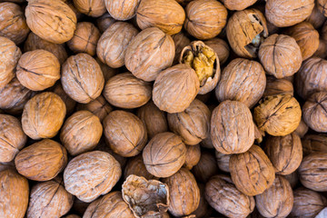 Walnut background.  lot of walnuts in the peel