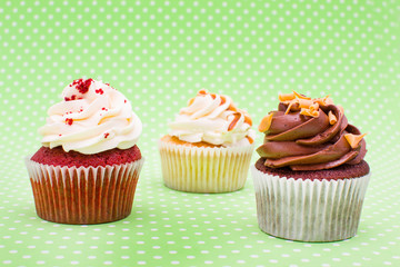 Some cupcakes on green background