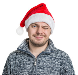 Portrait of a man with red Santa hat. Isolated on white.