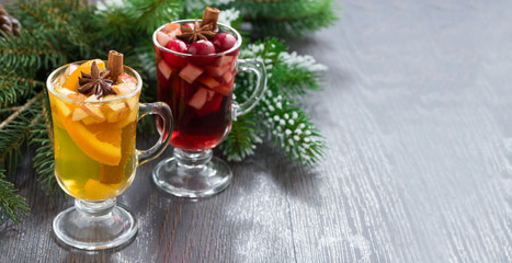Fototapeta na wymiar spicy Christmas drinks in glasses on a wooden background