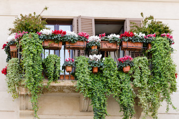 Fototapeta na wymiar traditional balcony with flowers, old style, Italy