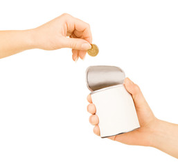 hand puts a coin in the tin on a white background