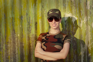 Smiling Young Woman in Soldier Camouflage Outfit