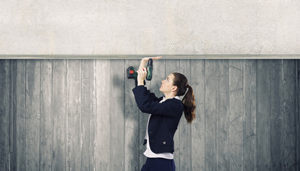 Woman using drill