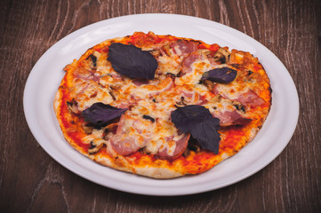 hand made pizza on white plate