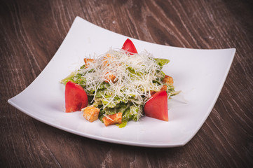 vegetarian cesar salad with tomato, croutons and cheese