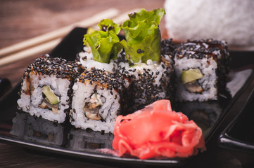eel sushi roll with sesame seeds
