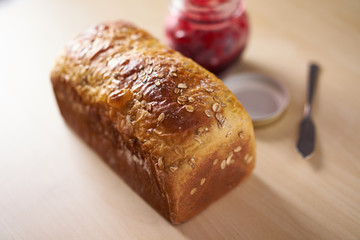 Freshly baked bread with strawberry jam