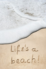 Conceptual life is a beach text in sand and water