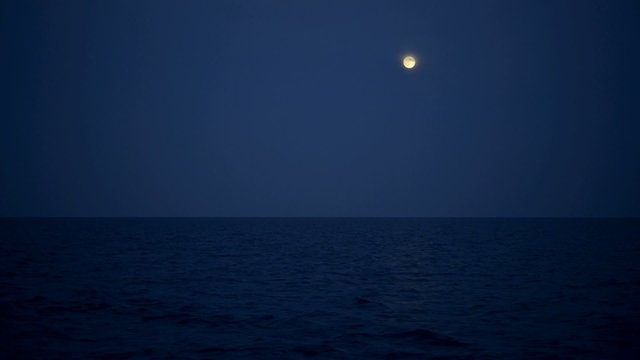 moon over night sea surface