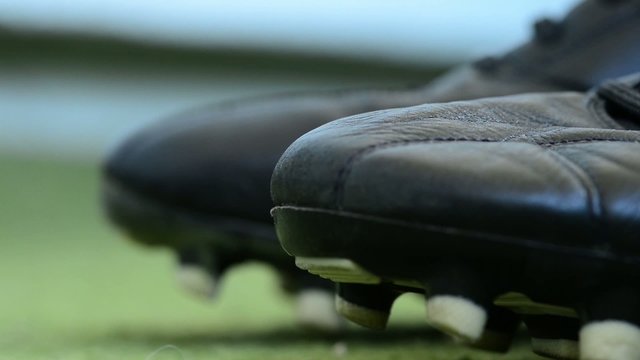 Close up thrown soccer shoes