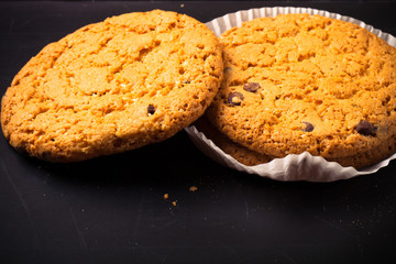 Oat cookies on the old shabby background. tinted