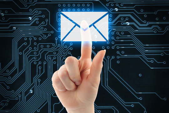 Hand pushing virtual mail button on digital background .