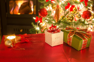 Fototapeta na wymiar gifts, candles, fireplace, christmas tree