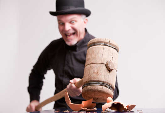 madcap laughs with big hammer on money