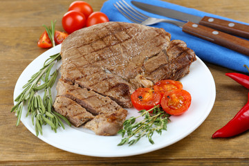 Delicious grilled meat on table