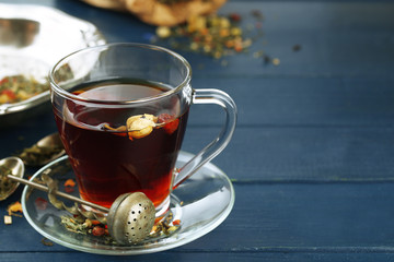 Beautiful vintage composition with herbal tea, on wooden table