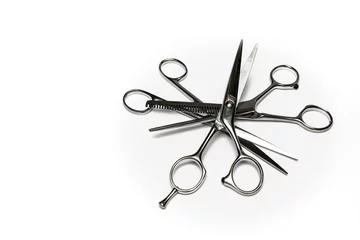 Fotobehang Kapsalon star shaped by hairdresser scissors