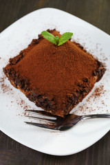 Yummy chocolate cupcake on table