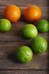 Ripe citrus on wooden background