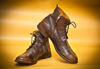 Men's shoes in retro style on a yellow abstract background