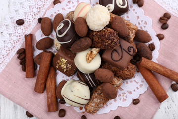 Heap of sweet chocolates with coffee beans