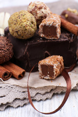 Pile of chunk of chocolate and truffles with cinnamon stick