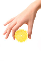 Hand holding lemon