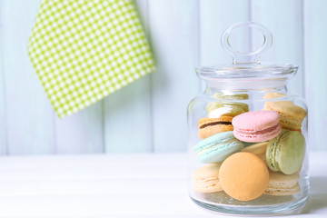 Gentle colorful macaroons in glass jar
