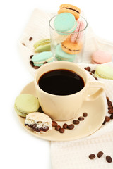 Gentle colorful macaroons in glass bowl and black coffee in mug