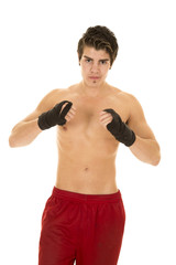 man no shirt red shorts hand wrapped for fighting up