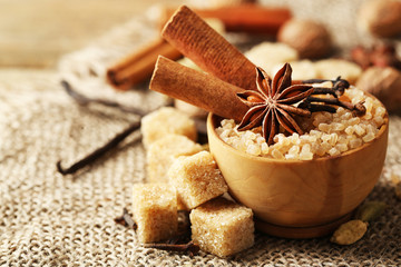 Christmas spices and baking ingredients on sackcloth background