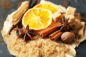 Christmas spices and baking ingredients on wooden background