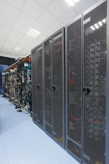 Different servers and disk arrays arranged in racks
